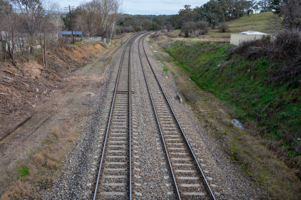 Railway bed. Fragment of railway tracks, top view, rails and sleepers.