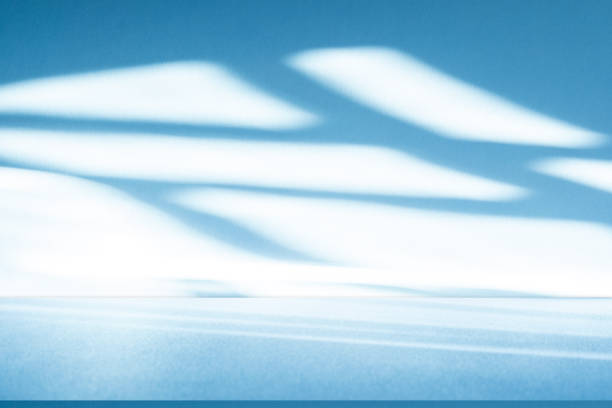 istock Wall interior background, studio, and backdrops show products. with shadow from window color white and blue light. background for text insertion and presentation of product 2180659857