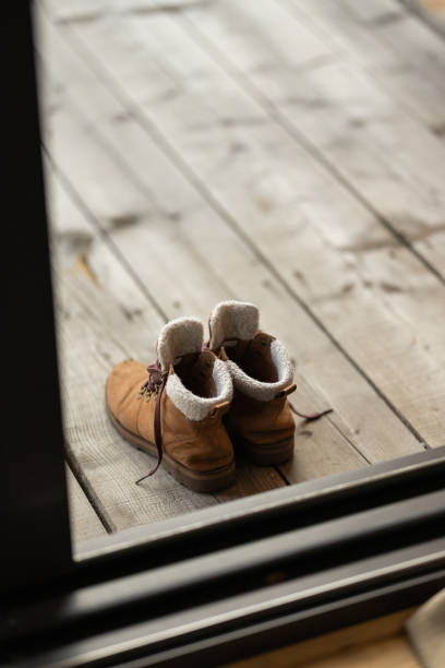 High angle shot of pair of boots on balcony without people