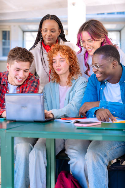 istock Group of students, prepare for university exams, use a laptop.Vertical 2180663014