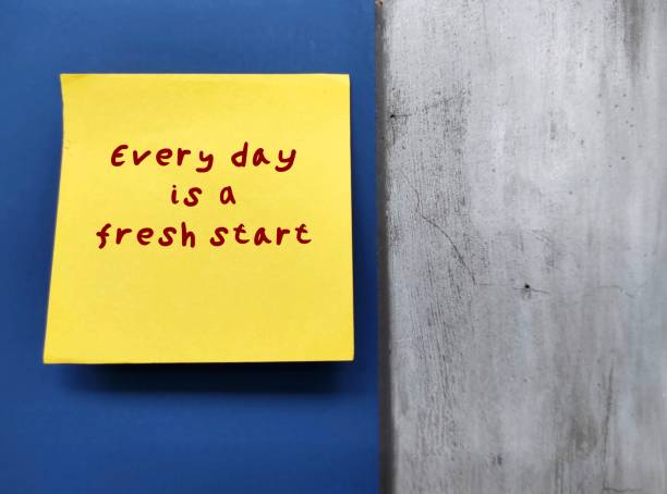 Note stick on blue wall written EVERY DAY IS A FRESH START - positive morning affirmation with the right mindset motivation to create a day filled with gratitude positivity and contentment