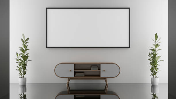 istock Empty picture frame for an exhibit is mounted on a white wall in a hallway corridor or living room. 2180663622