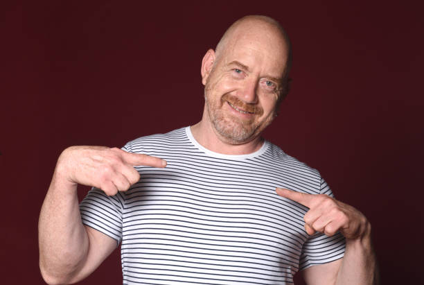 istock man pointing fingers at himself on red background 2180664725