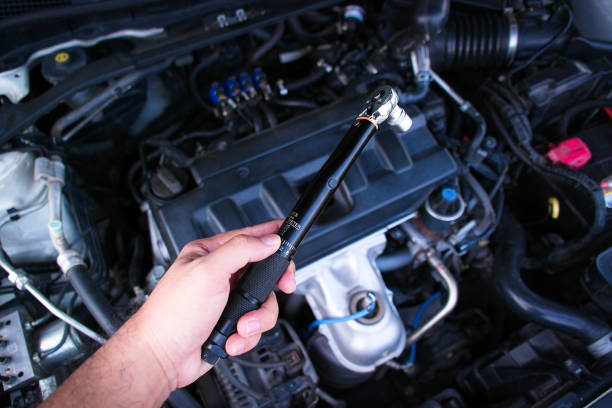 istock Auto mechanic hand holding torque wrench or socket wrench 2180666725