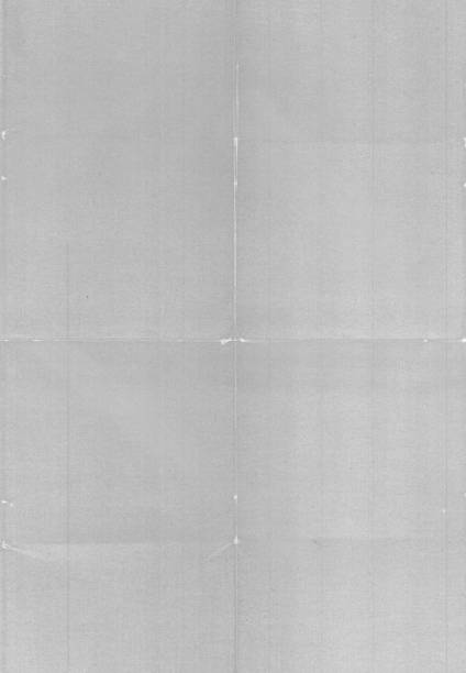 digital macro photo of paper with printer ink on it and folding marks.