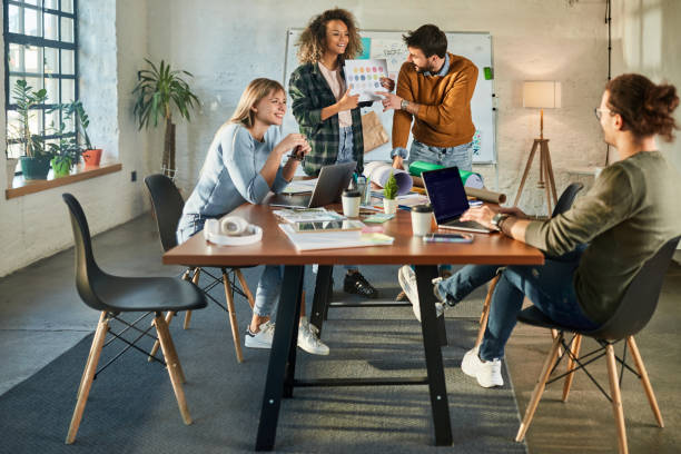 istock Young happy creative team having a meeting at casual office. 2180674191