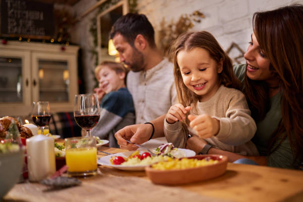 istock Happy family enjoying during lunch in dining room. 2180675573