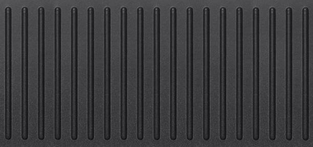 istock Black corrugated stripped metal ridge background 2180676487