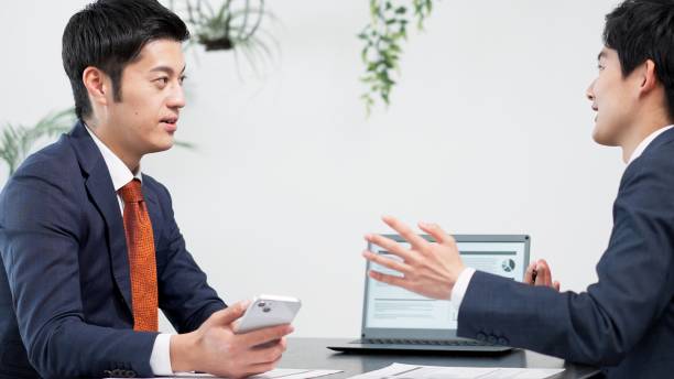 istock Businessman using smartphone at a meeting 2180676666