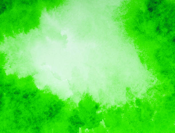 istock green watercolor background. hand painted by brush 2180676973