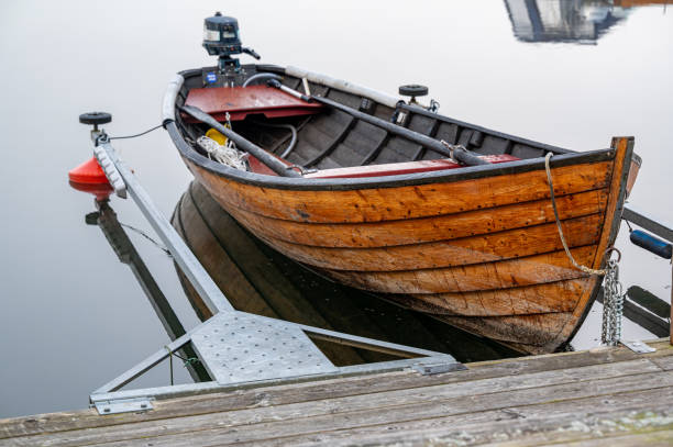 istock Old beautiful wooden punt with small engine 2180677653