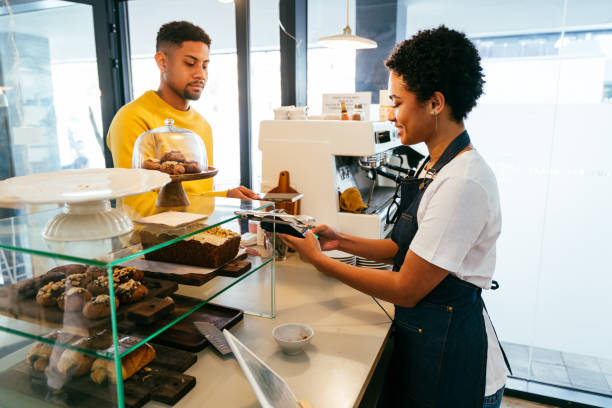 istock Barista working in a bar cafeteria 2180679923