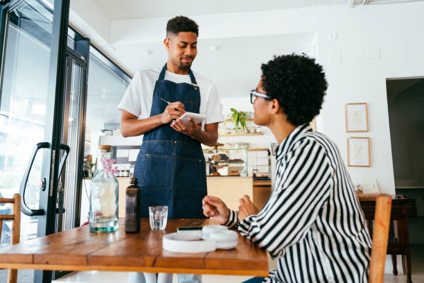istock Barista working in a bar cafeteria 2180680728