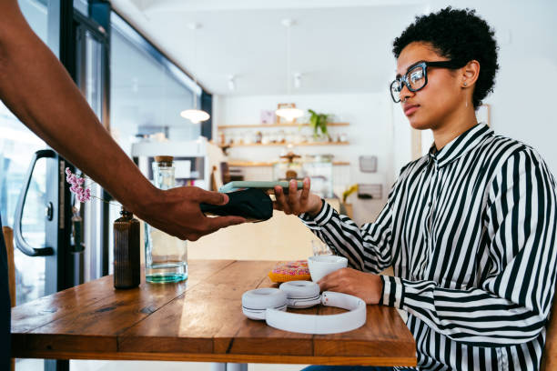 istock Barista working in a bar cafeteria 2180680781