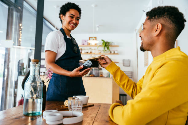 istock Barista working in a bar cafeteria 2180680882