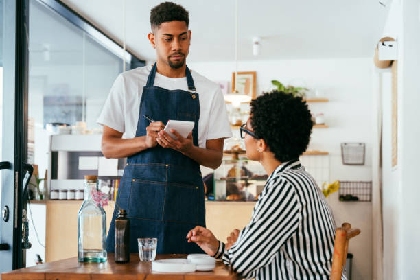 istock Barista working in a bar cafeteria 2180681148