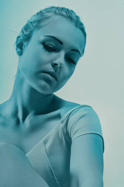 istock Young woman wearing leotard looking down with sad expression 2180681232