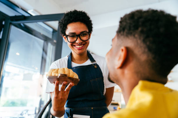 istock Barista working in a bar cafeteria 2180681360