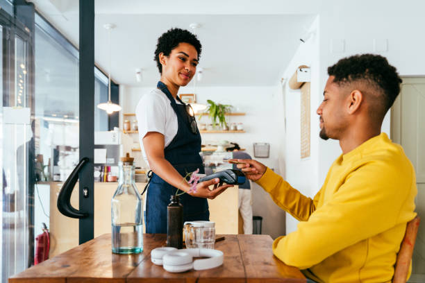 istock Barista working in a bar cafeteria 2180682115