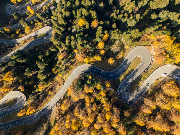 istock Top Down Aerial View, Winding Mountain Road Through Autumn Forest 2180682357