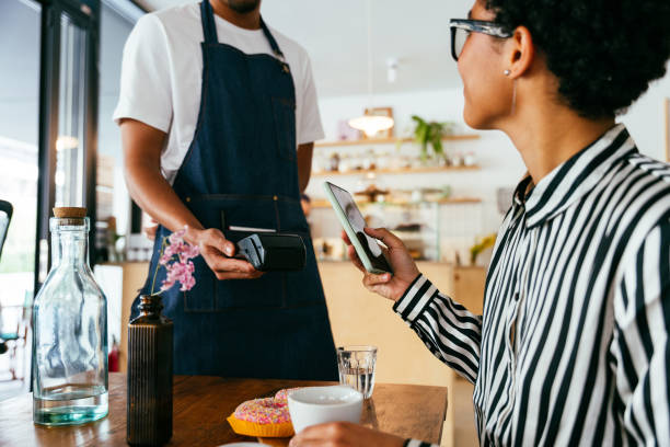 istock Barista working in a bar cafeteria 2180682374