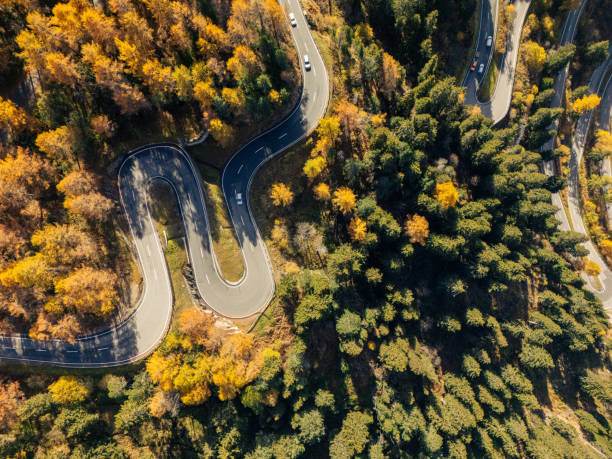 istock Winding Mountain Road Through Autumn Forest, Maloja Pass 2180682459