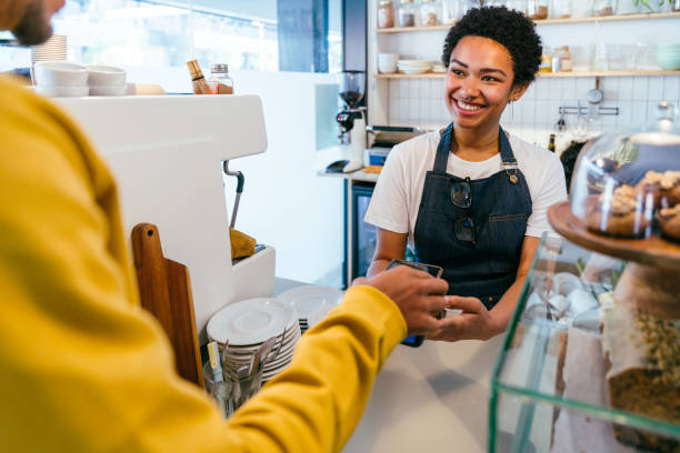 istock Barista working in a bar cafeteria 2180682515