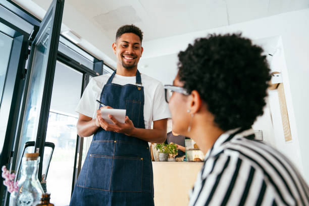 istock Barista working in a bar cafeteria 2180682768