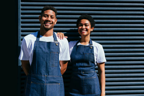 istock Barista and waiter working in a bar cafeteria shop 2180683027