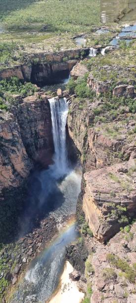 istock Aerial view of a stunning waterfall with rainbow. 2180683252