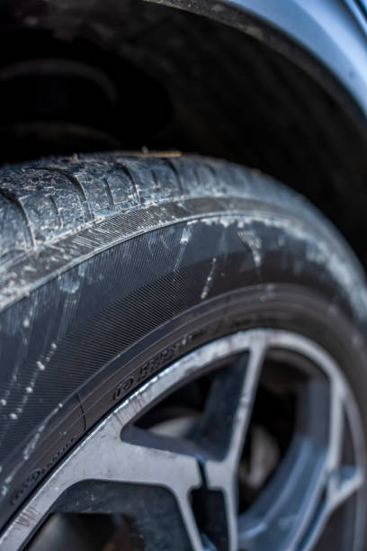 istock Summer tire dirty on car 2180683522