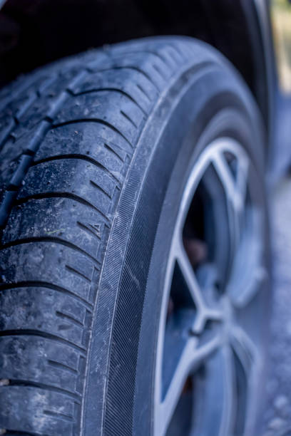 istock Summer tire dirty on car 2180683525