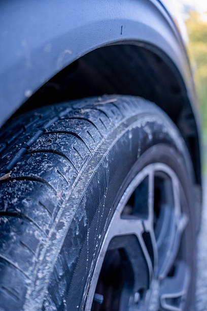 istock Summer tire dirty on car 2180683535