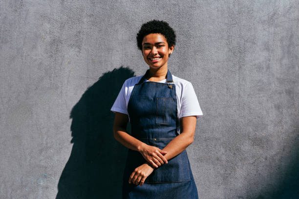 istock Barista working in a bar cafeteria 2180685397