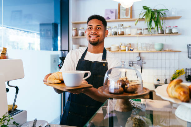 istock Barista working in a bar cafeteria 2180685985