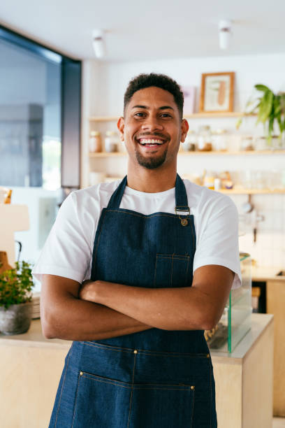istock Barista working in a bar cafeteria 2180686466