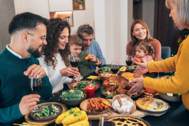 istock Family enjoy Thanksgiving lunch together 2180687338