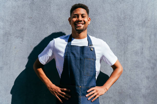 istock Barista working in a bar cafeteria 2180687417