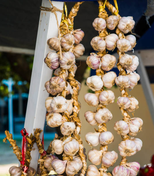 istock Three wreaths of garlic hang side by side 2180687458