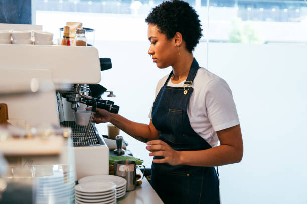 istock Barista working in a bar cafeteria 2180687542