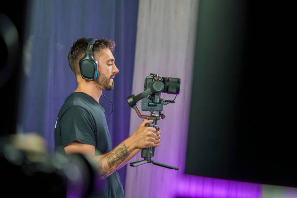 istock Camera Operator Filming on a Professional TV Set 2180688243