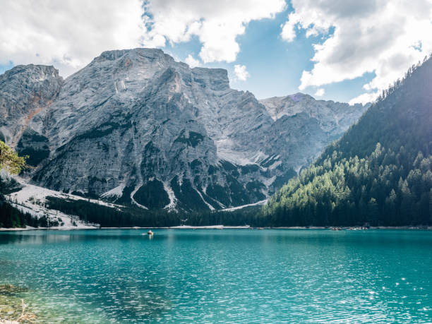 istock Turquoise lake reflecting surrounded by italian dolomites mountains 2180688354