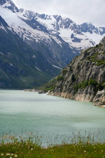 istock Majestic Alpine Lake with Snow-Capped Mountains 2180689343