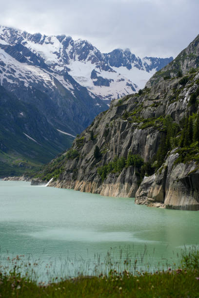 istock Majestic Alpine Lake with Snow-Capped Mountains 2180689344