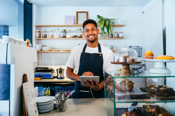 istock Barista working in a bar cafeteria 2180691565