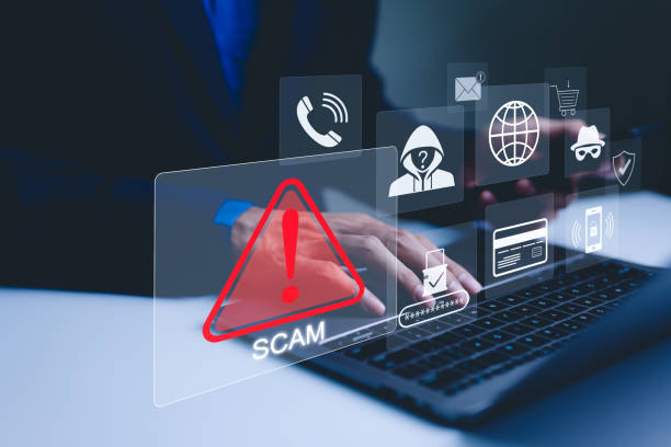 scam alert warning with cybersecurity icons. a person using laptop, warning sign for scams with icons representing online threats, phishing, and cybersecurity. unknown person, suspicious scammer, - achterdocht fotos stockfoto's en -beelden