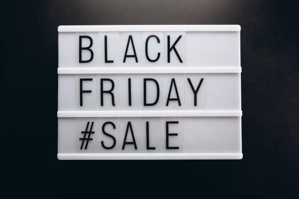 istock Creative promotion composition Black friday sale text on lightbox on black background 2180698854