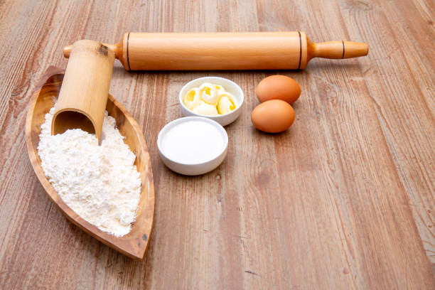 Preparing sweet with rolling pin and wooden pounder