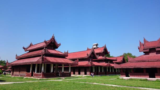 Mandalay, Myanmar – October 20, 2018: Ancient buildings of Mandalay Palace complex under a clear blue sky
