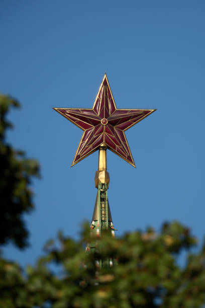 istock Kremlin star. The Ruby Star of the Moscow Kremlin with blue sky in the background. 2180701449